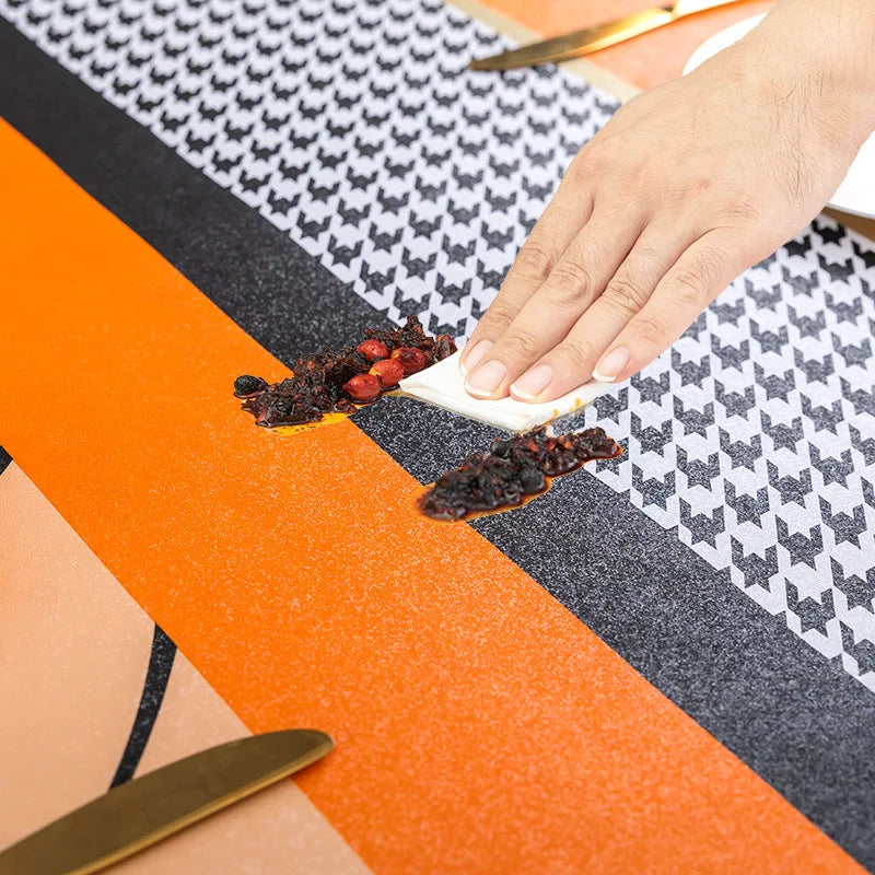 Nappe de table orange à motifs abstraits